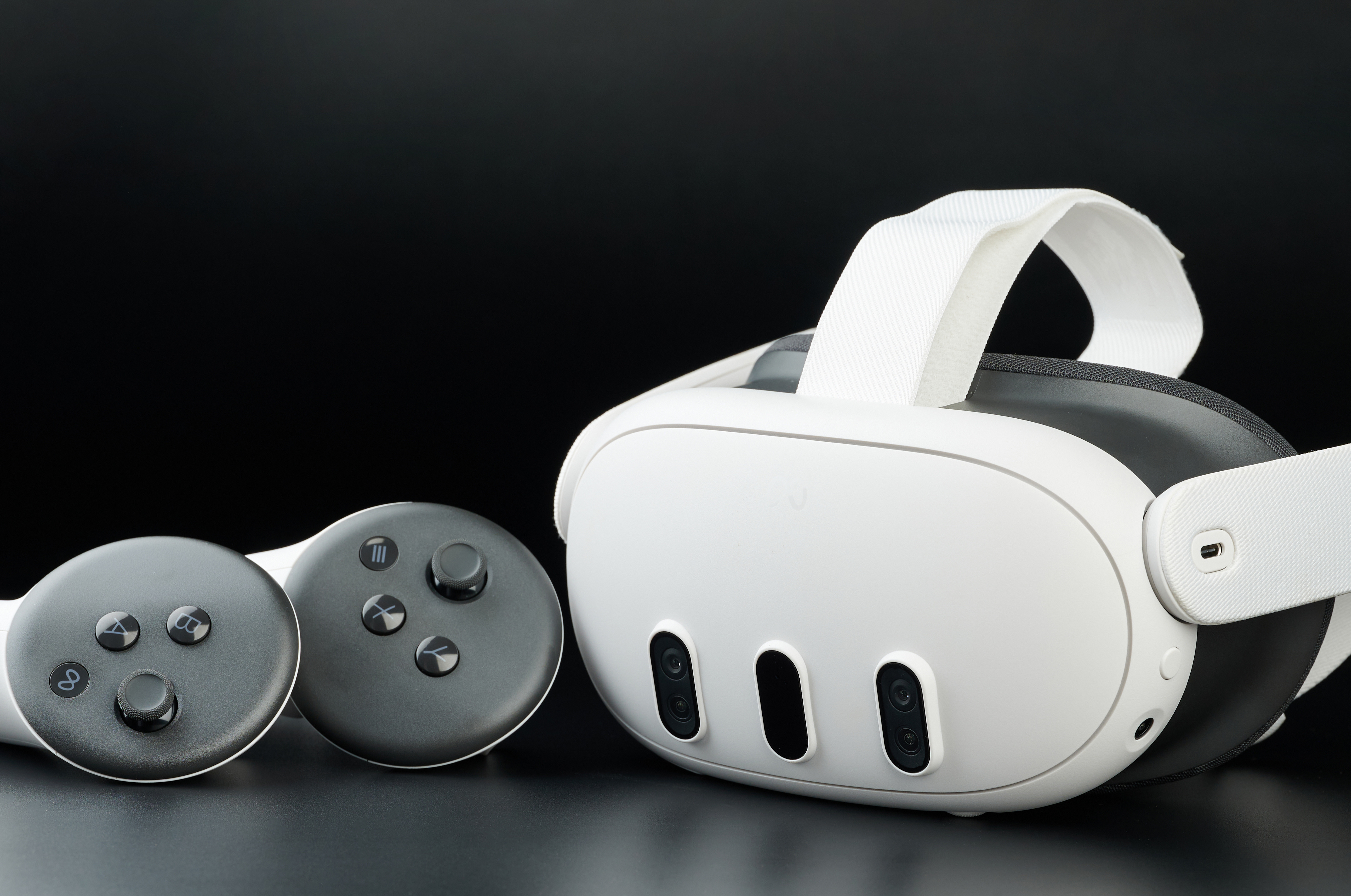 Meta Quest 3 virtual reality headset with two hand controllers.