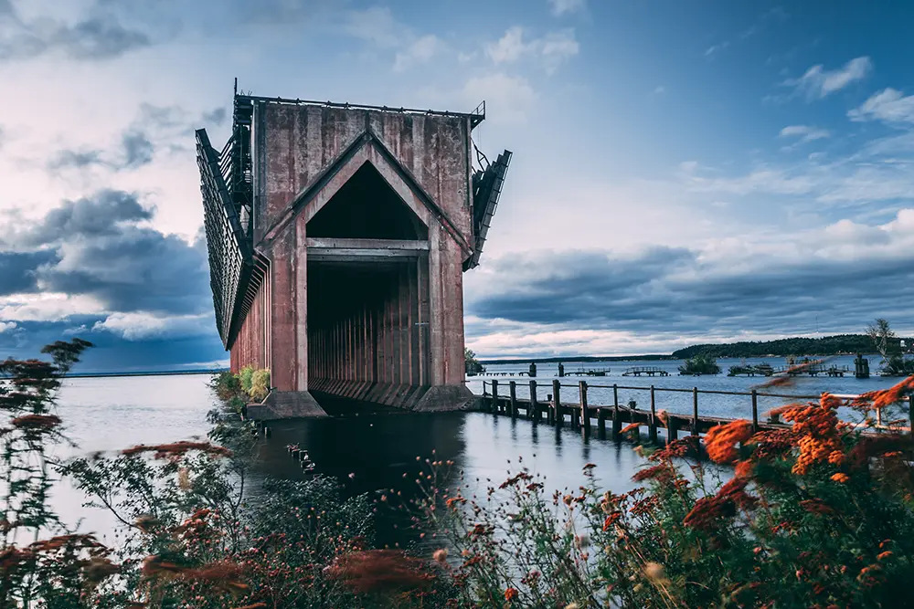 Marquette, Michigan's lower harbor ore dock framed with orange flowers.
