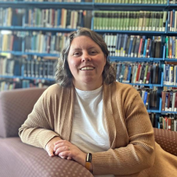 Emera sitting in the sunlight at the Lydia Olson Library.