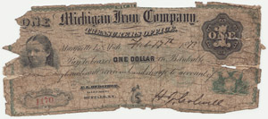A tattered Michigan Iron Company $1 Note