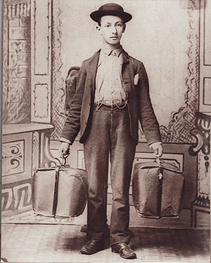 A Jewish salesman holding two bags